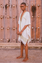 Load image into Gallery viewer, Poncho Clestine full-length view against a wooden door