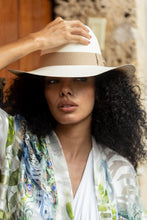 Load image into Gallery viewer, Natural Panama Extra-fine hat with beige band, worn by a model
