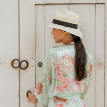 Load image into Gallery viewer, Natural Panama Extra-fine hat with black band — lifestyle view
