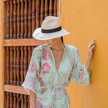 Load image into Gallery viewer, Natural Panama Extra-fine hat with black band — lifestyle view
